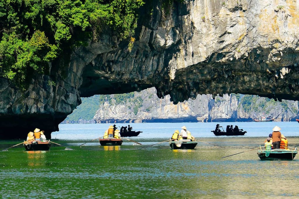 Kayaks and bamboo boats at Luon Cave in Halong Bay