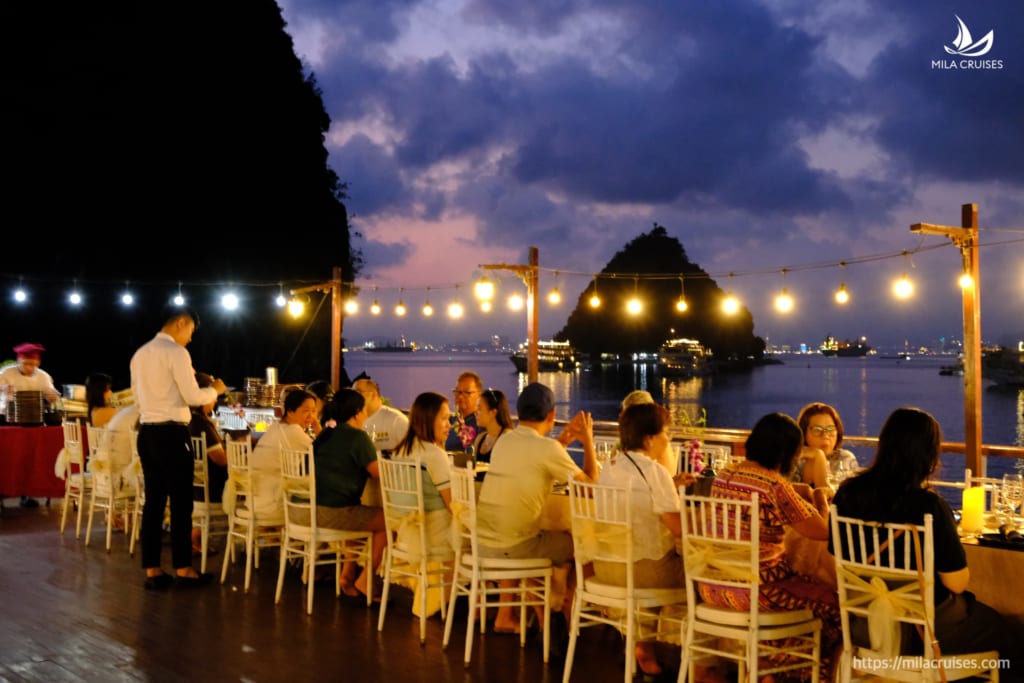 Luxury candlelit dinner on the Milalux sundeck at dusk