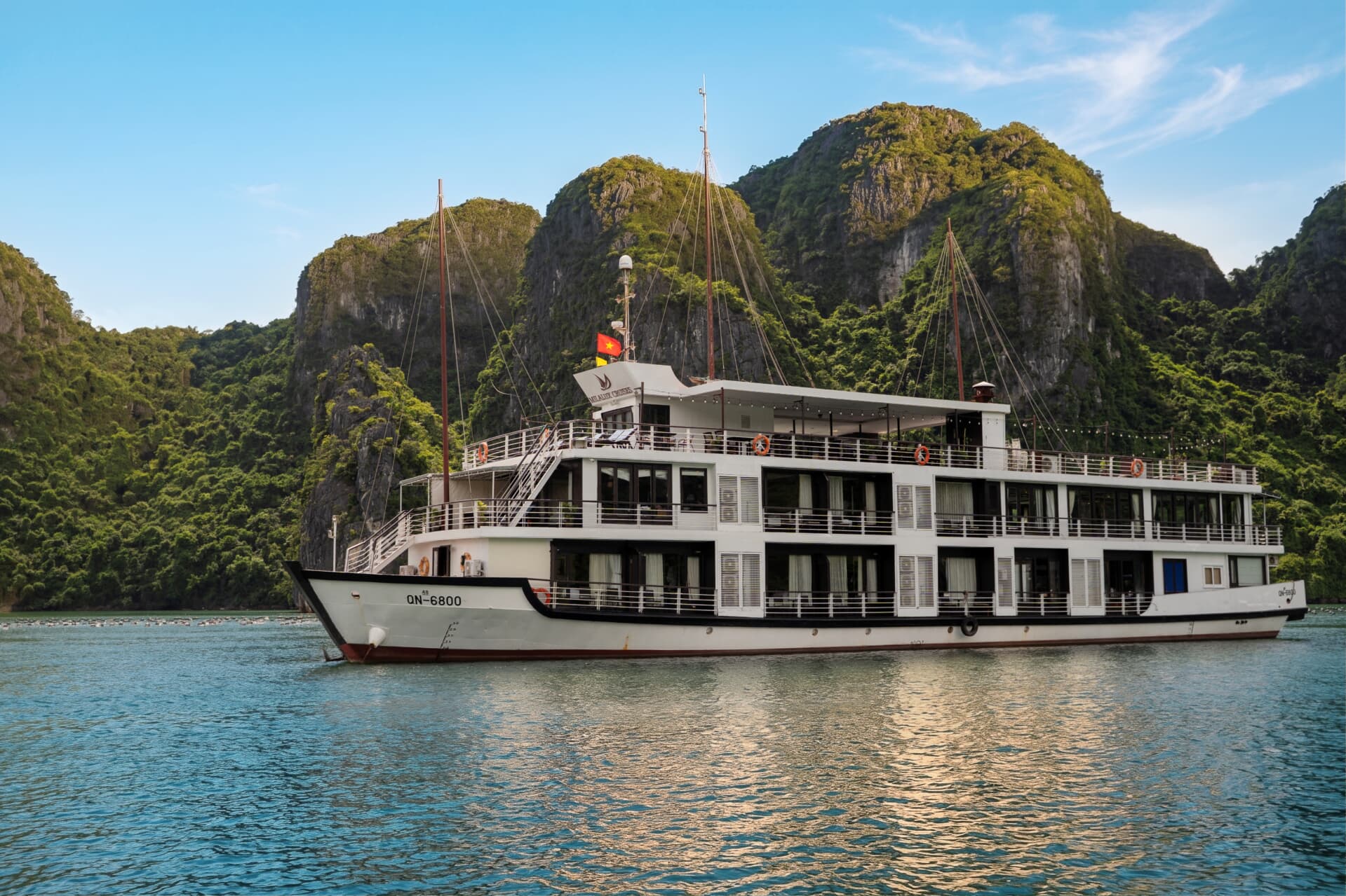 Milalux cruise ship sailing among limestone karsts in Halong Bay