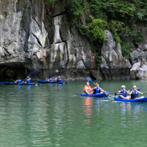 Kayaking among limestone karsts in Halong Bay