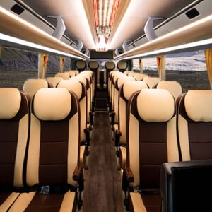 Interior of Milalux limousine bus with leather reclining seats