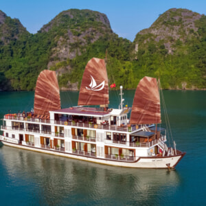 Milalux cruise with red junk sails in Halong Bay