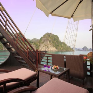 Royal Suite private terrace with sun loungers facing limestone islands
